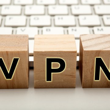 price cost cyberghost  vpn services vpn written on wooden blocks white computer keyboard in the background